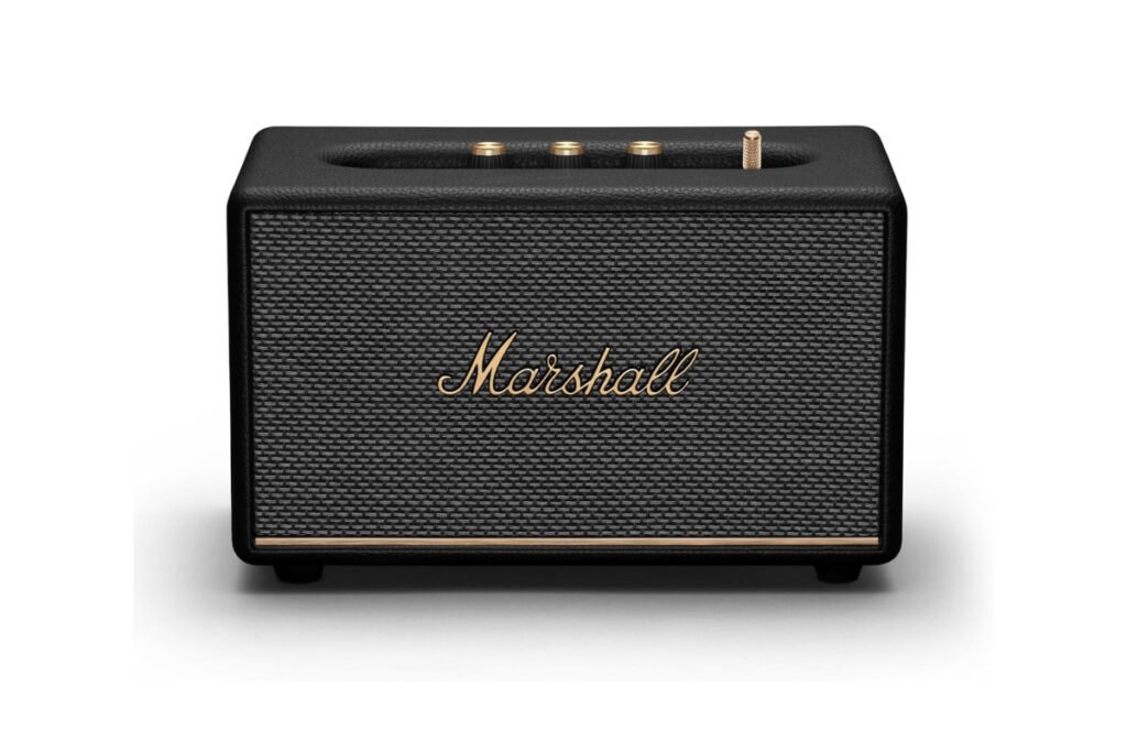 Vista superior del Marshall Acton III mostrando los controles físicos de volumen, graves y agudos en panel dorado.
